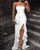 Sequined bandeau evening dress with high slit and ruffles