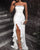 Sequined bandeau evening dress with high slit and ruffles